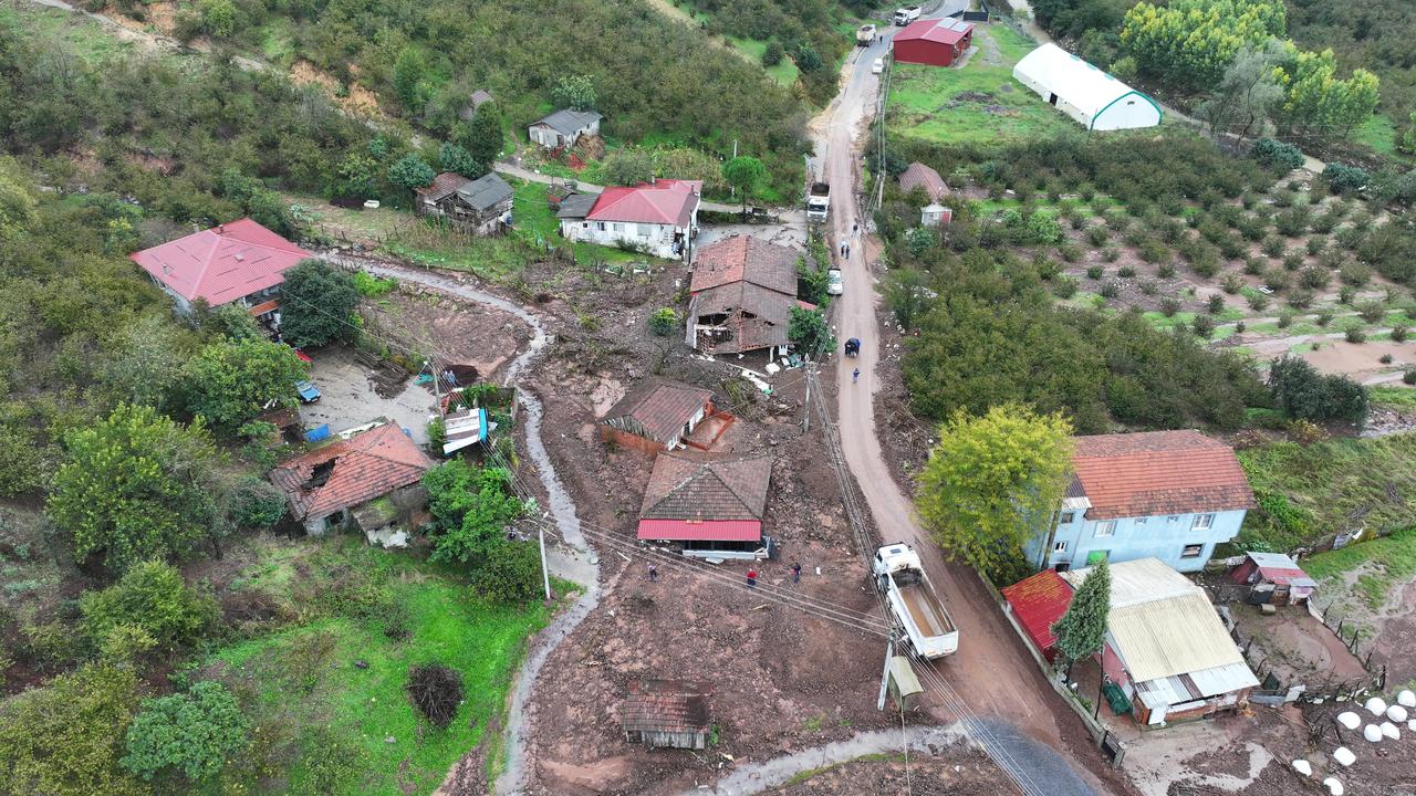 An aerial view shows homes surrounded by mud, rocks and debris following heavy rainfall and a landslide in the Karanlikdere neighborhood of Karasu, Sakarya, Türkiye, Oct. 16, 2026. (AA Photo)