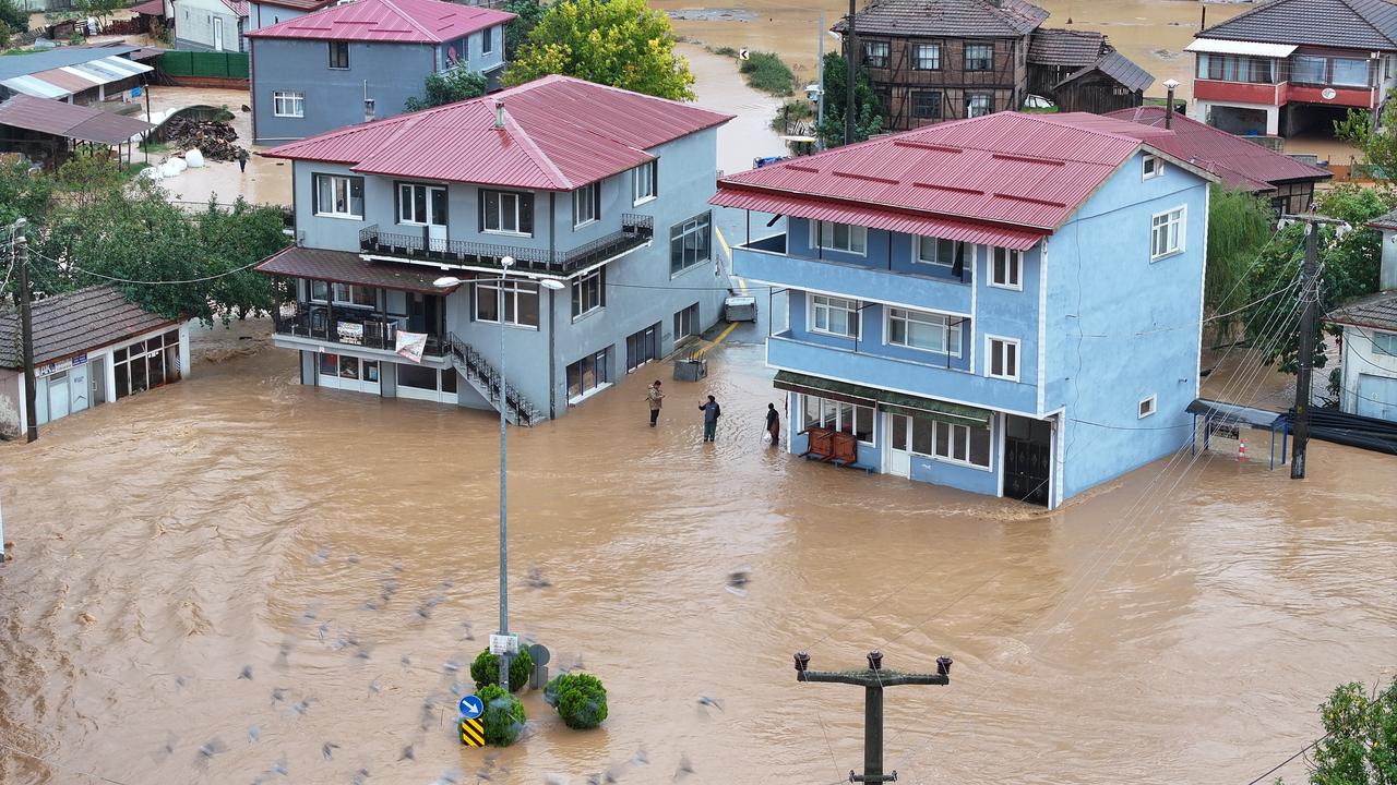 An aerial view shows muddy floodwaters surrounding residential buildings and inundating streets following heavy rainfall in Sakarya, Türkiye, Oct. 15, 2026. (AA Photo)