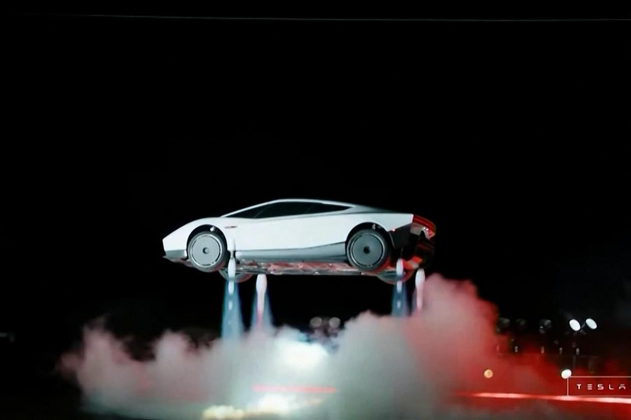A grab taken on October 16, 2026 from a live feed released by Tesla shows the company unveiling on October 15 its next-generation Roadster electric car in McGregor, Texas, United States. (Photo by Tesla)