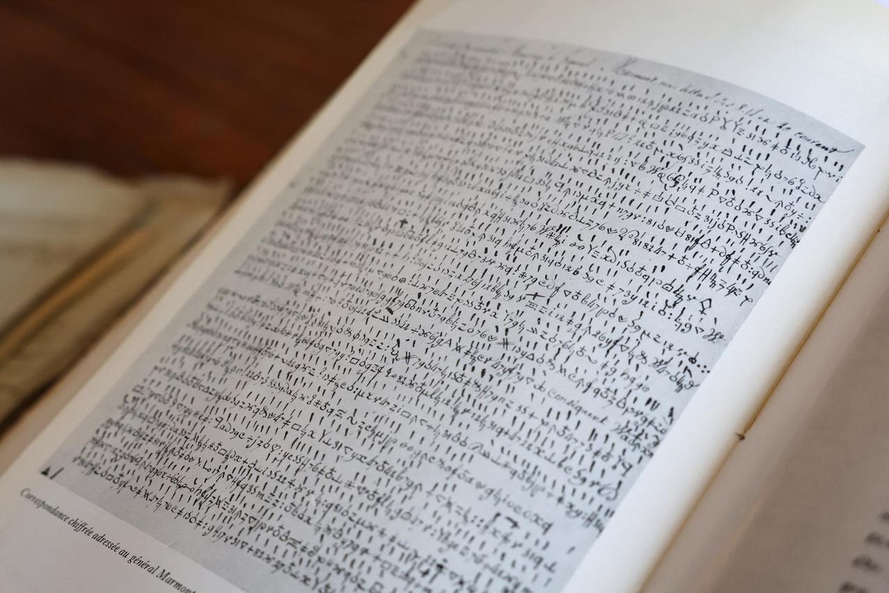 This photograph taken at military archives at the Vincennes castle, outside Paris, on October 15, 2026 shows of a reproduction of a wartime letter addressed to one of Napoleon's generals written in secret code in 1809, detailing the positions of French troops. (AFP Photo)