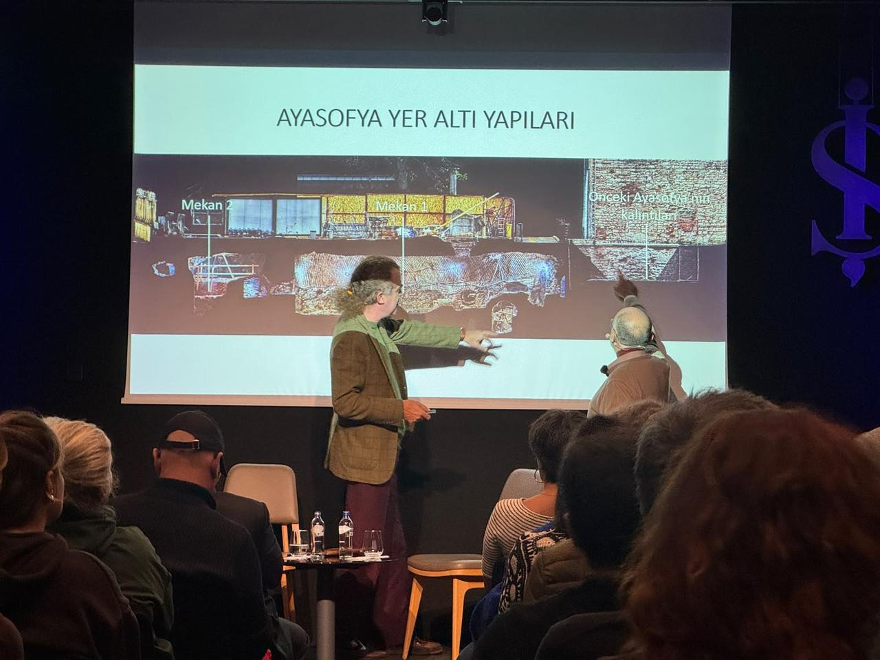 Professor Hasan Firat Diker presents archaeological findings from beneath Hagia Sophia, highlighting underground structures and remains of earlier buildings during a talk in Istanbul, Türkiye, October 16, 2026. (AA Photo)