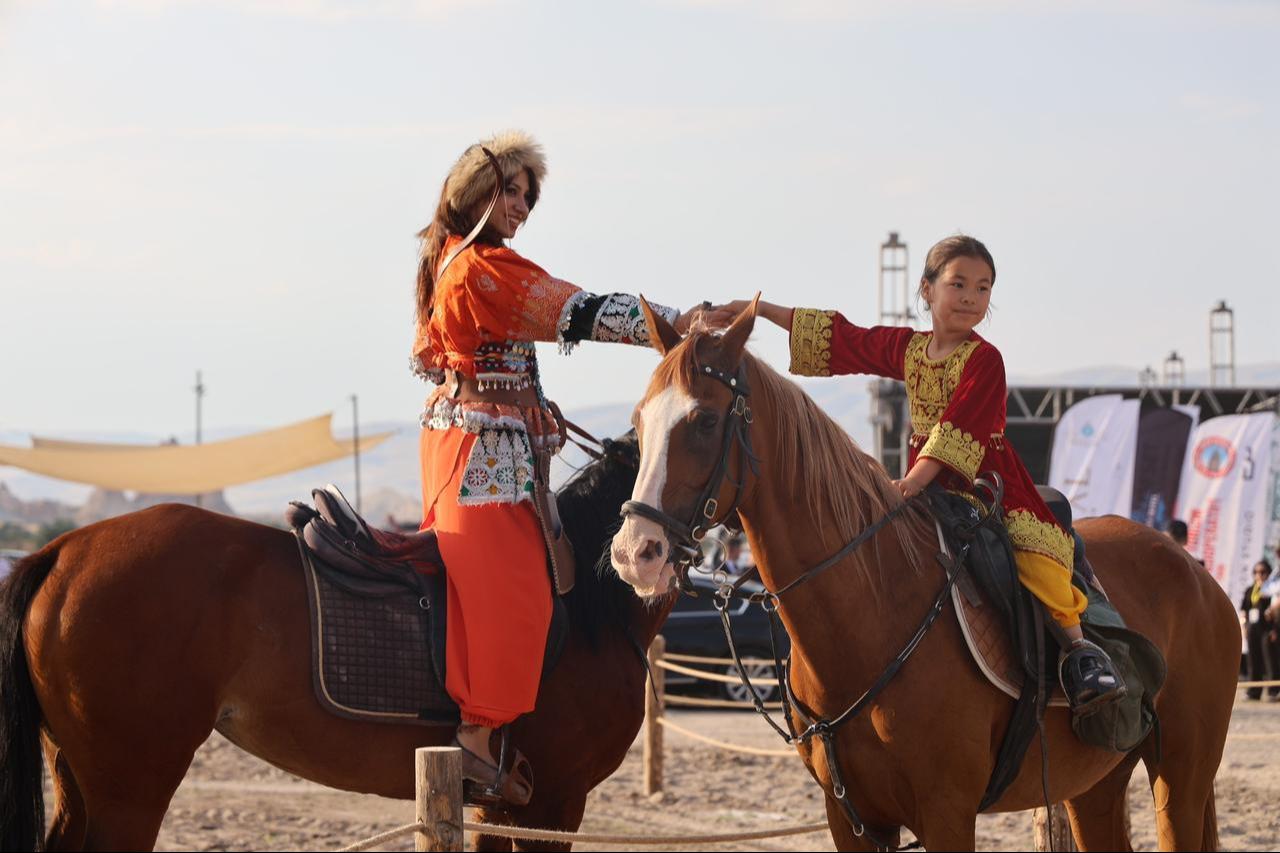 Visitors watched horse training demonstrations and equestrian displays against the backdrop of Cappadocia's iconic landscape. Nevsehir, Türkiye, July 3, 2026. (IHA Photo)
