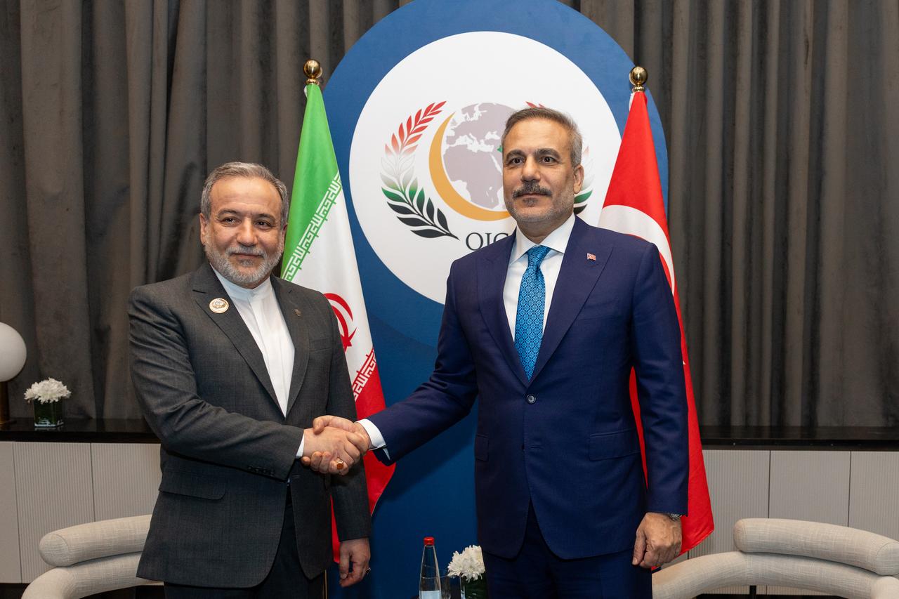 Turkish Foreign Minister Hakan Fidan meets with Iranian Foreign Minister Abbas Araghchi on the margins of the 52nd Session of the Council of Foreign Ministers (CFM) of the Organisation of Islamic Cooperation (OIC) in Baghdad, Iraq, Oct. 17, 2026. (AA Photo)