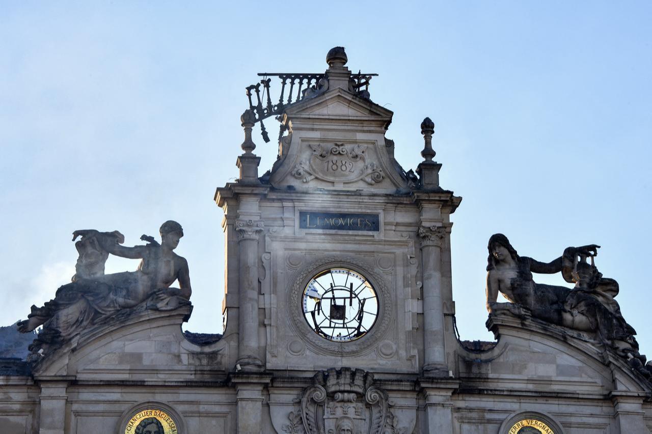 This photograph shows the partially burnt facade of the Limoges city hall following the collapse of its belfry a day after riot and looting following nationwide protests against the "high cost of living." (AFP Photo)