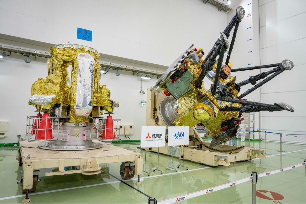 The propulsion module, left, and the exploration and return modules of JAXA’s Martian Moons eXploration (MMX) spacecraft are displayed at the Tanegashima Space Center in Minamitane, Kagoshima prefecture, Japan, Aug. 13, 2026. (AFP Photo)