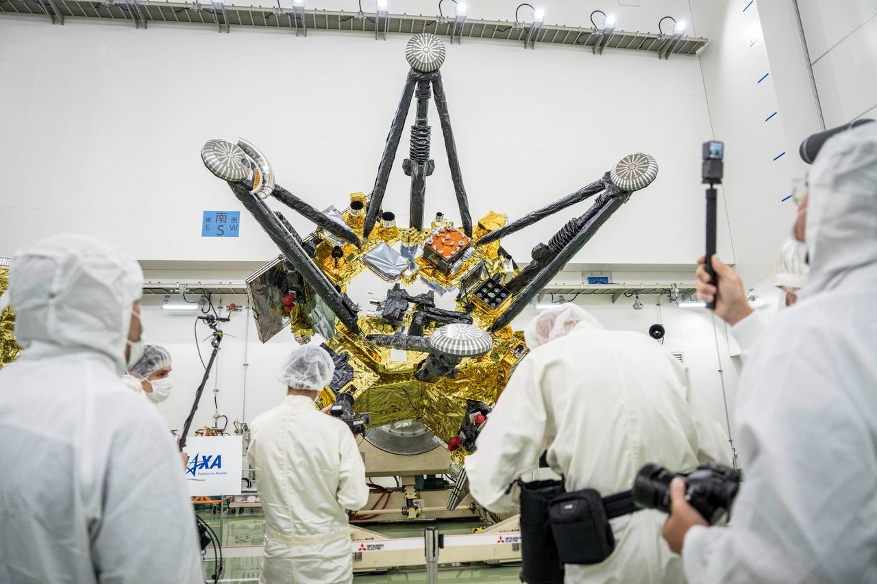 Members of the media photograph JAXA’s Martian Moons eXploration (MMX) spacecraft at the Tanegashima Space Center in Minamitane, Kagoshima prefecture, Japan, Aug. 13, 2026. (AFP Photo)