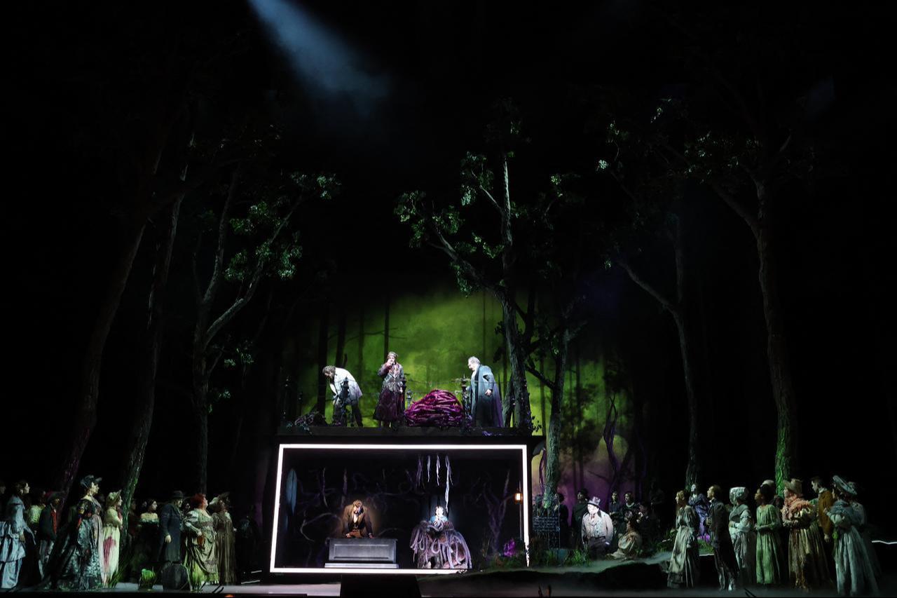 The cast performs on the forest-themed set during a dress rehearsal of Lincoln in the Bardo at the Metropolitan Opera in New York, October 2026. (AFP Photo)