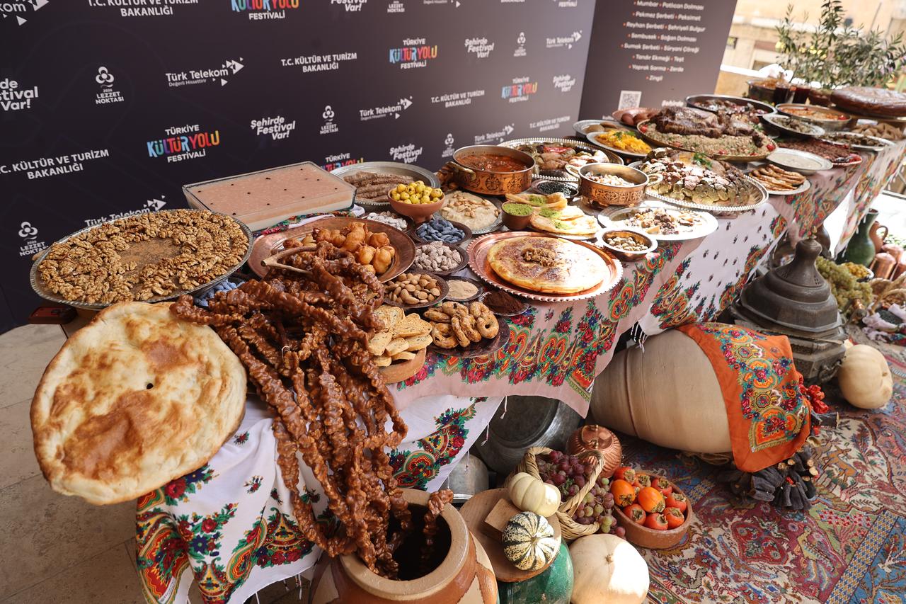 Traditional regional dishes, breads, desserts and local produce are displayed during the Mardin Culture Route Festival in Mardin, Türkiye, Oct. 17, 2026. (AA Photo)