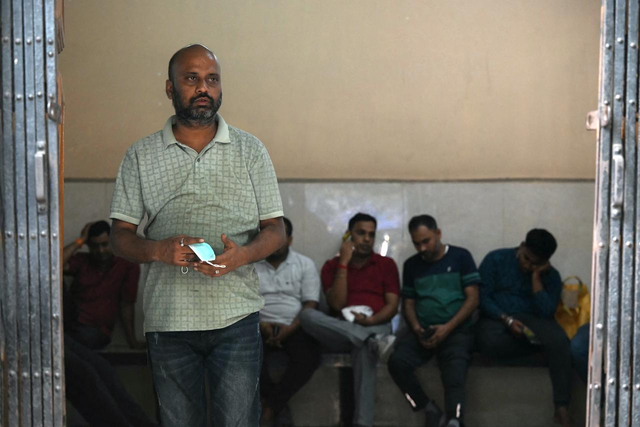 Relatives wait to receive bodies of victims killed in a stampede during a religious gathering, at a government mortuary in Kolkata on October 18, 2026. (AFP Photo)