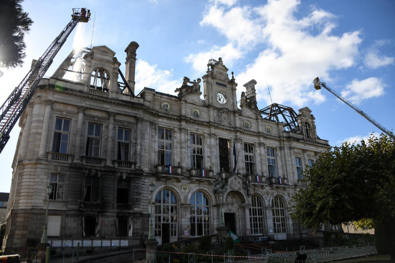This photograph shows the partially burnt facade of the Limoges city hall a day after riots and looting following nationwide protests against the "high cost of living" in Limoges on October 18, 2026. (AFP Photo)