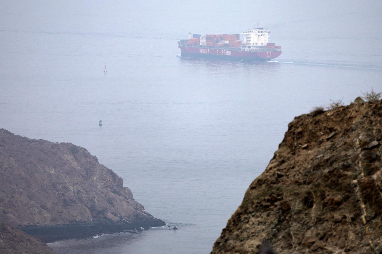 The Chinese-flagged container shipping vessel Hui Fa transits the Gulf of Oman off the coast of Khor Fakkan in the emirate of Sharjah in the east of the UAE on October 13, 2026. (AFP Photo)