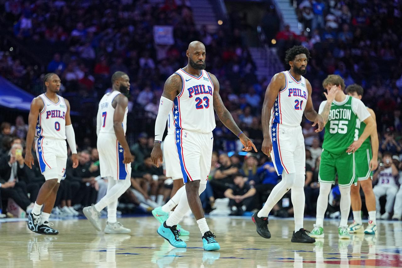 Philadelphia 76ers' LeBron James (23) walks alongside teammate Joel Embiid (21) during an NBA game against the Boston Celtics in Philadelphia, Pennsylvania, U.S., Oct. 17, 2026. (AFP Photo)