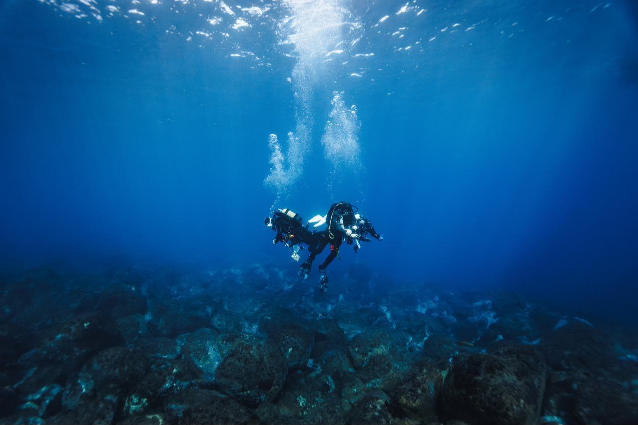 Two scuba divers swim above a rocky seabed during an underwater exploration dive off the coast of Portugal, Oct. 18, 2026. (AFP Photo)