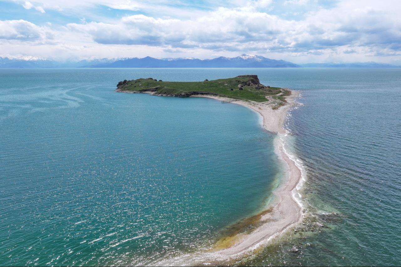 An aerial view shows the ancient road to Carpanak Island in Lake Van, where water loss due to drought and excessive evaporation has caused some historical structures and microbialites, formed over thousands of years, to become visible as a result of shoreline retreat, in Van, Türkiye, April 11, 2025. (AA Photo)