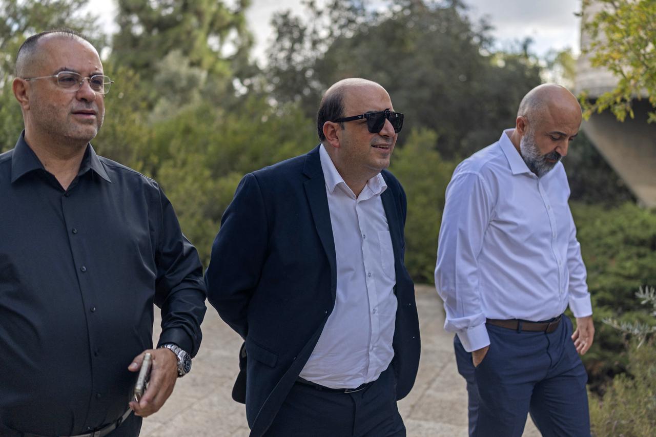 Sami Abu Shehadeh (C), leader of the Balad party, arrives at the Supreme Court in Jerusalem on October 1, 2026. (AFP Photo)