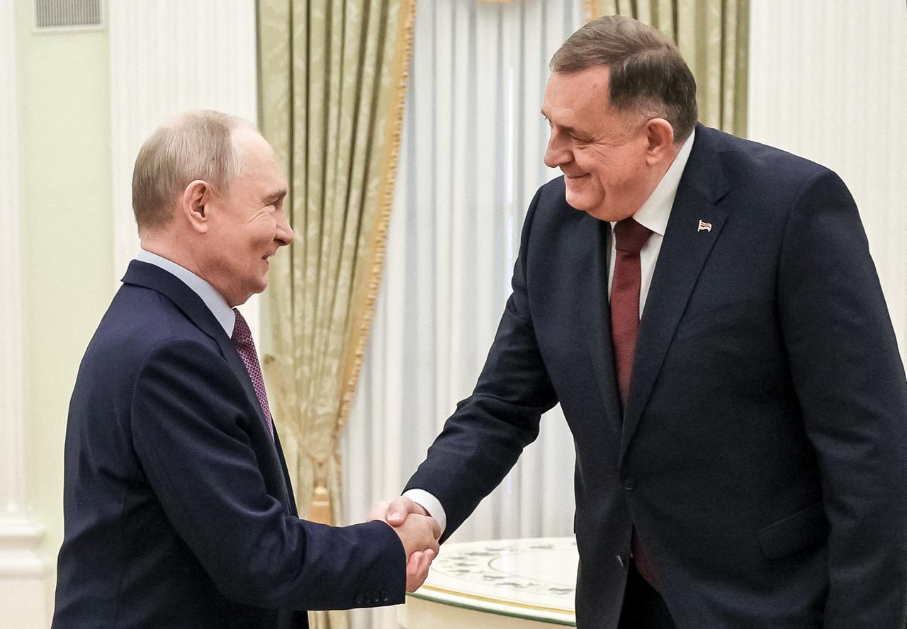 In this pool photograph distributed by the Russian state agency Sputnik, Russia's President Vladimir Putin meets with Bosnian Serb politician Milorad Dodik in Moscow on September 29, 2026. (POOL / AFP Photo)