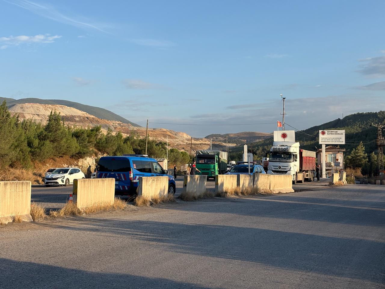 Security forces and vehicles are seen near the entrance to the Imbat mining operation after a mine collapse in Soma, Manisa, Türkiye, Oct. 2, 2026. (IHA Photo)