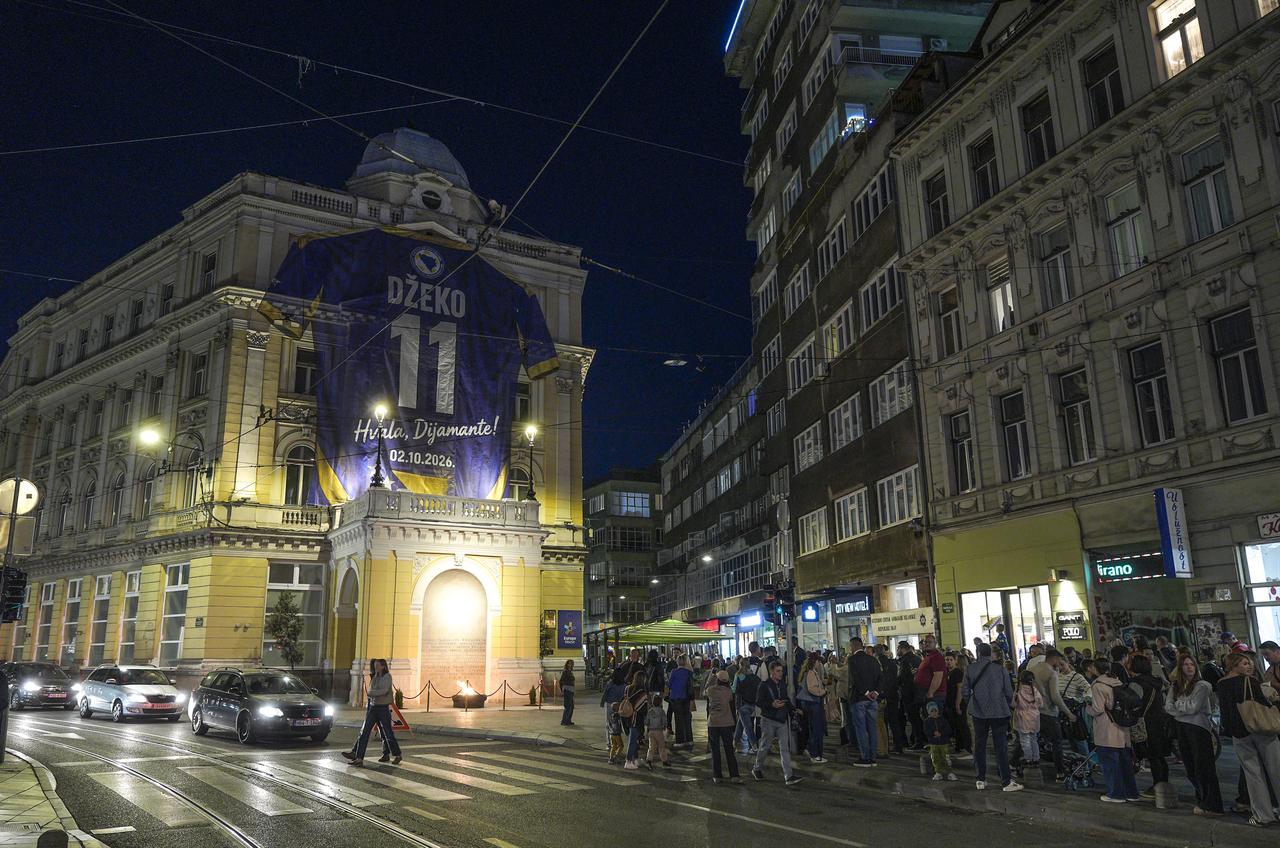 A giant Bosnia and Herzegovina jersey bearing Edin Dzeko's name and No. 11 is displayed on a building in central Sarajevo ahead of his farewell international appearance, Sarajevo, Bosnia and Herzegovina, Oct. 1, 2026. (AA Photo)