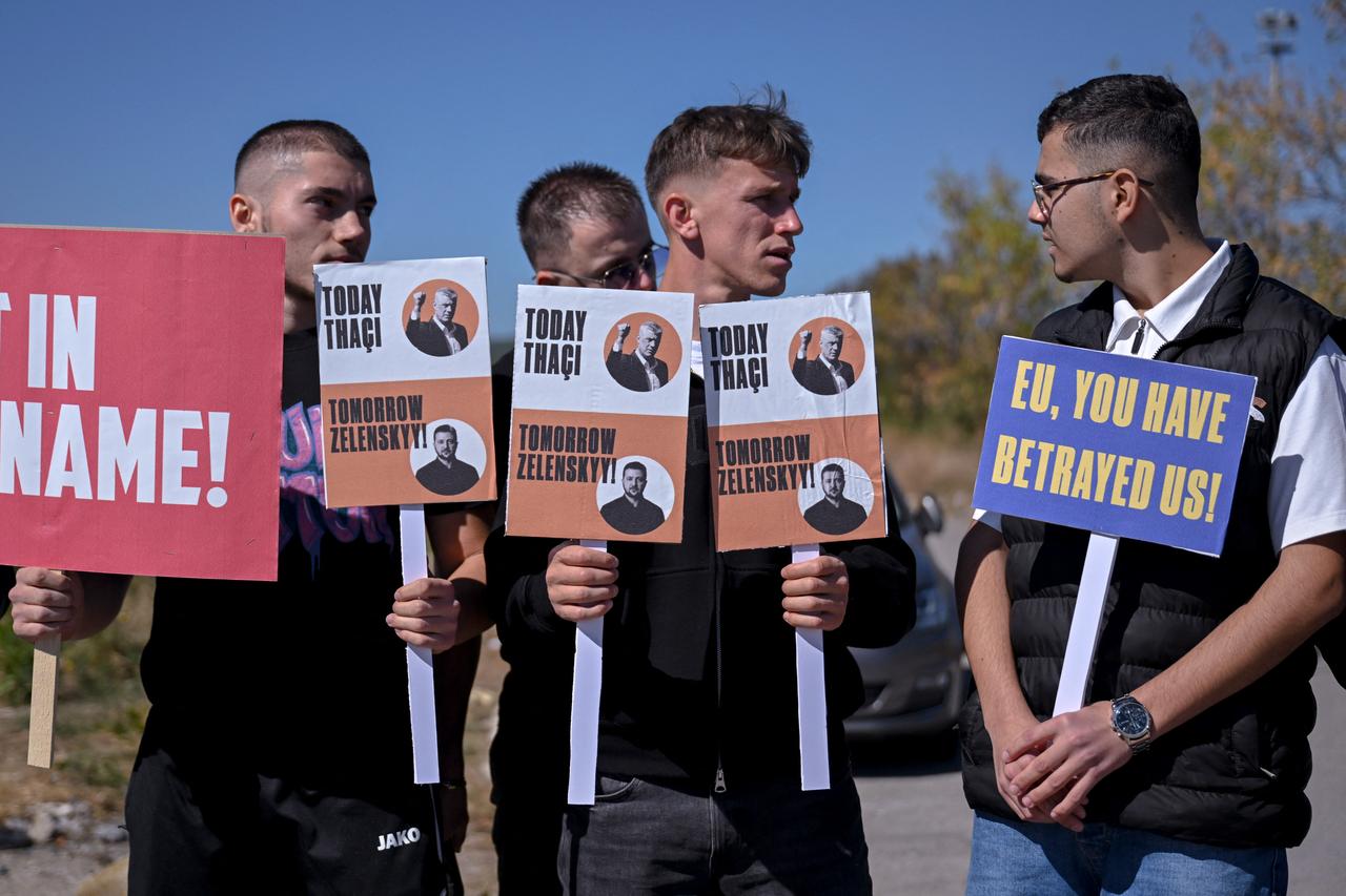 Kosovo Albanian youth demonstrators hold posters reading "Today Thaci - Tomorrow Zelensky" as they protest during the arrival of European Commission President Ursula Von Der Leyen at the Pristina International Airport, in Pristina on October 1, 2026. (AFP Photo)