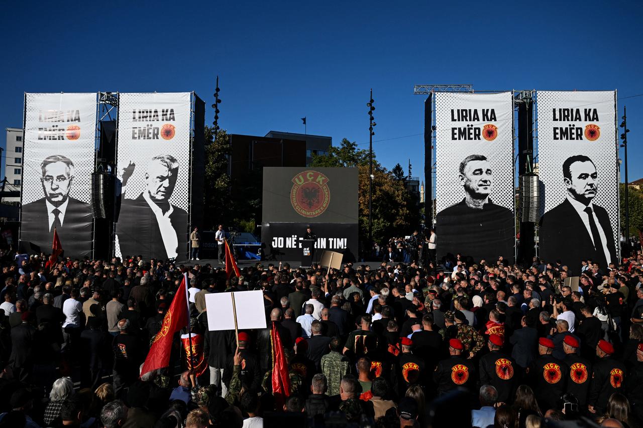 Kosovo Albanian protesters wave flags, hold placards and chant slogans as they take part in a rally in Pristina on October 1, 2026 to demonstrate against the sentence to 25 years in prison of Kosovo's former president Hashim Thaci by the Kosovo Specialist Chambers, based in the Netherlands. (AFP Photo)