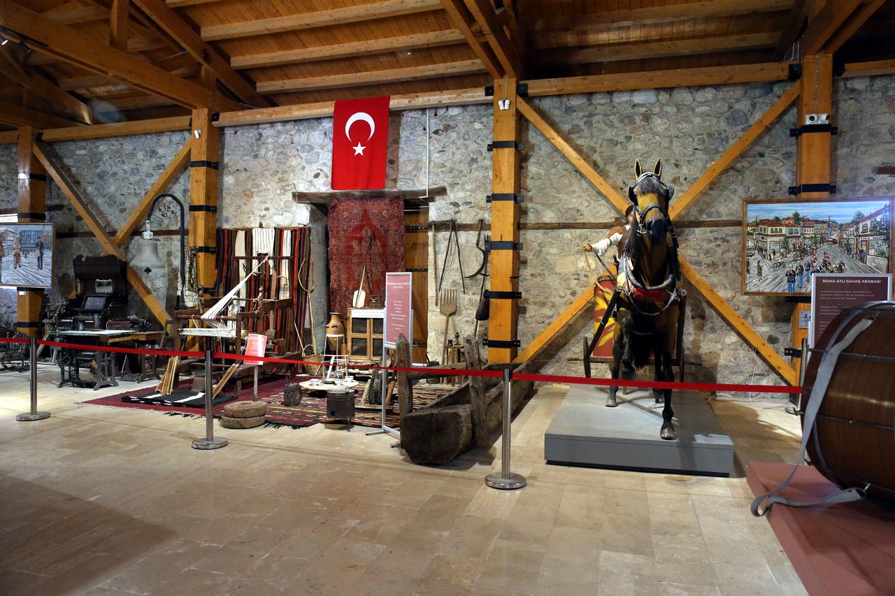 Traditional household objects, textiles and a horse-drawn display recreate aspects of everyday life in Zile at the Veni Vidi Vici City Museum in Tokat, Türkiye. (AA Photo)