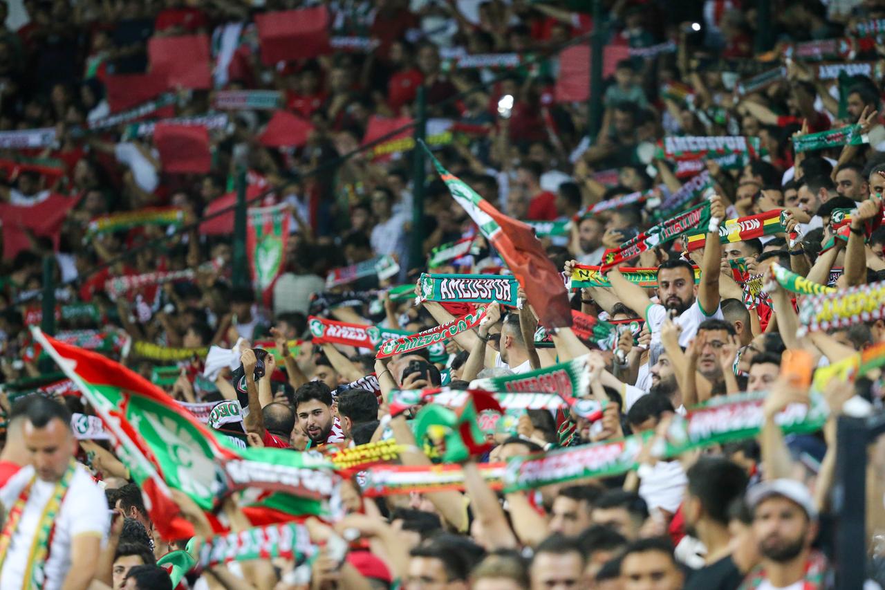 Amedspor supporters hold scarves and cheer from the stands during the Super Lig match against Besiktas at Diyarbakir Stadium in Diyarbakir, Türkiye, Sept. 20, 2026. (AA Photo)