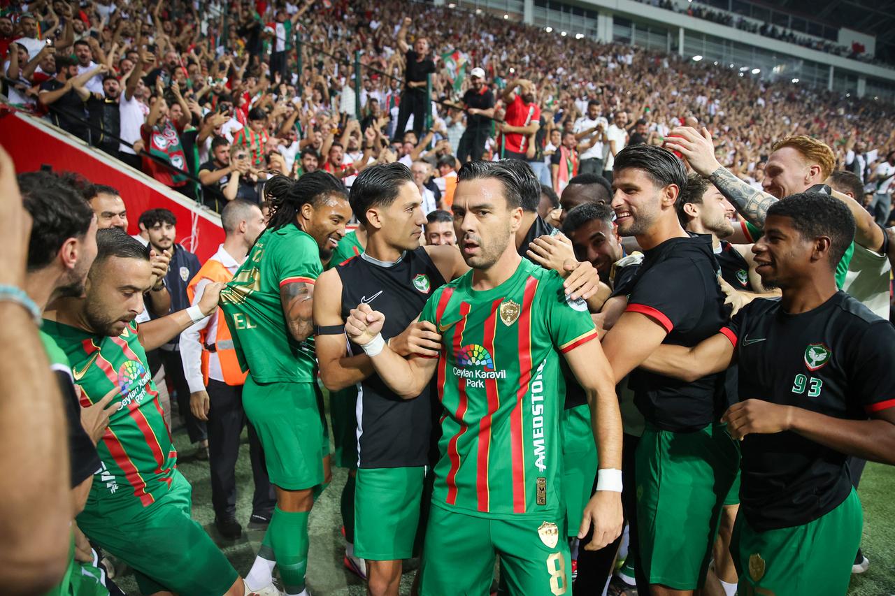 Amedspor players celebrate with supporters after their 3-2 Super Lig victory over Besiktas at Diyarbakir Stadium in Diyarbakir, Türkiye, Sept. 20, 2026. (AA Photo)