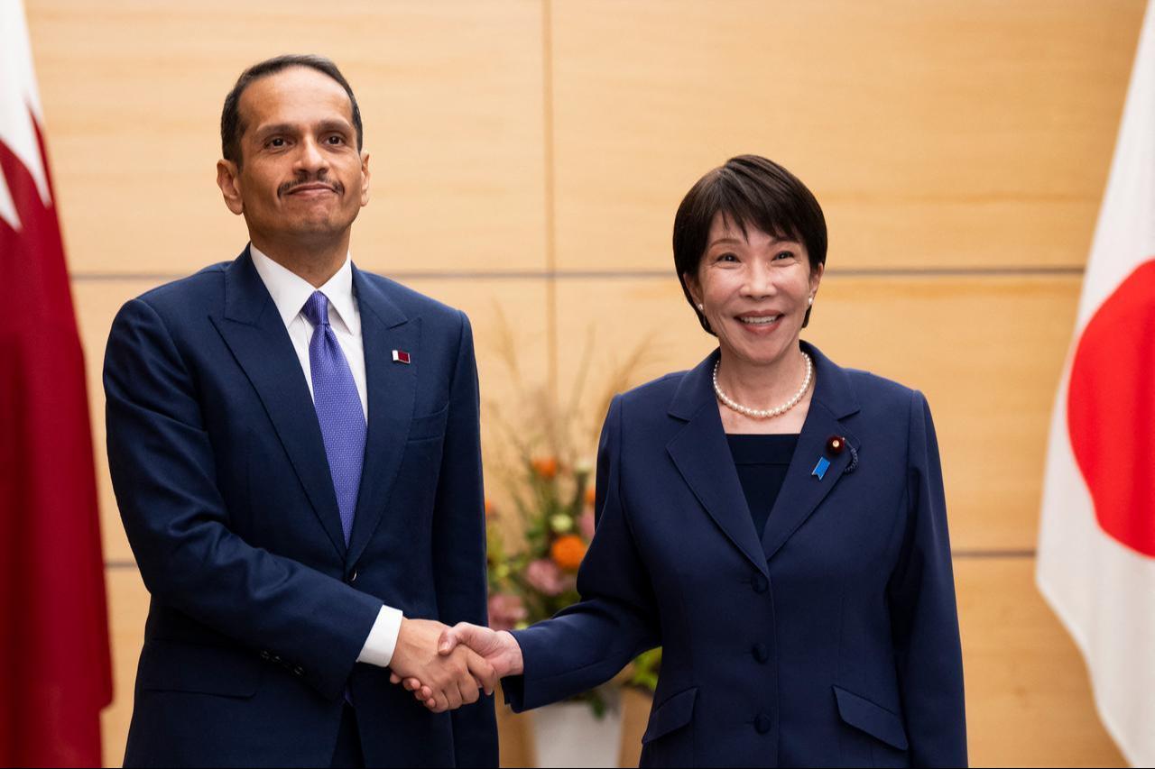 Japan's Prime Minister Sanae Takaichi (R) and Qatar's Prime Minister and Foreign Minister Sheikh Mohammed bin Abdulrahman bin Jassim Al-Thani shake their hands during a meeting at the prime minister's office in Tokyo, Oct. 2, 2026. (AFP Photo)