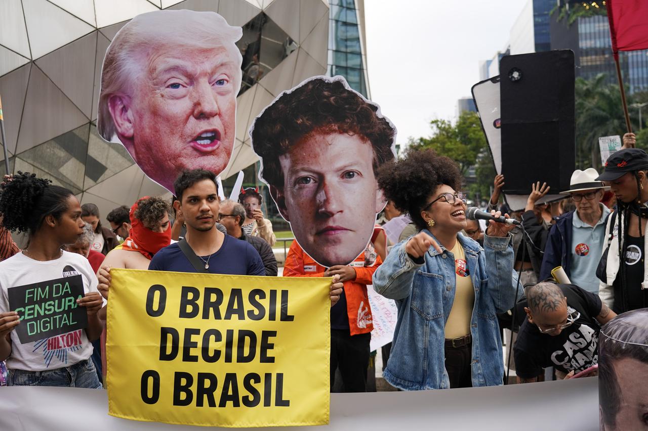 Members of digital rights groups gather outside Meta’s headquarters in Sao Paulo, Brazil, carrying banners to protest alleged arbitrary content restrictions and removals during the presidential election campaign, Oct. 19, 2026. (AA Photo)