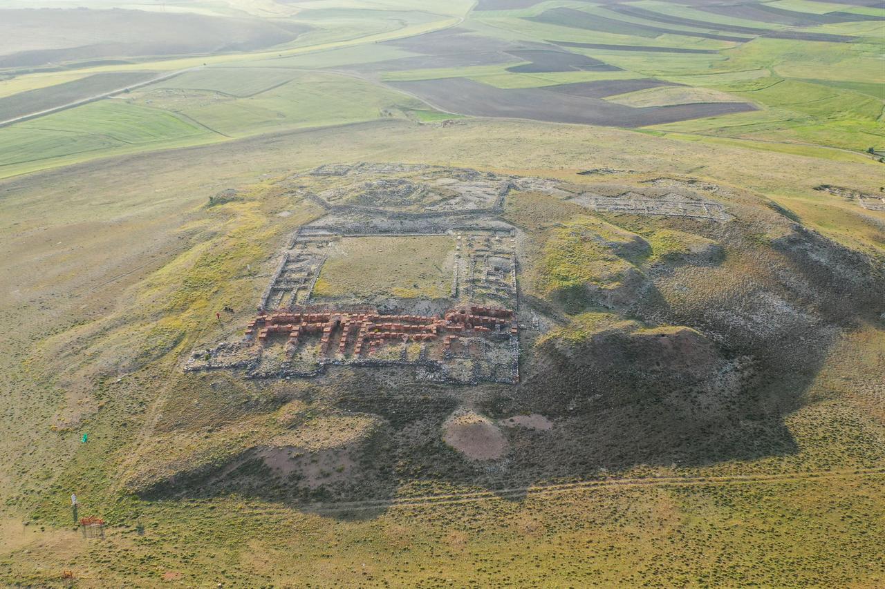 An aerial photograph shows the archaeological remains of the ancient Hittite city of Sarissa, surrounded by agricultural fields in Sivas, Türkiye, Oct. 19, 2026. (AA Photo)