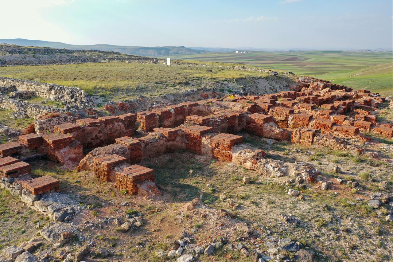 Excavated red-brick structures and stone walls are seen at the archaeological site of the ancient Hittite city of Sarissa in Sivas, Türkiye, Oct. 19, 2026. (AA Photo)