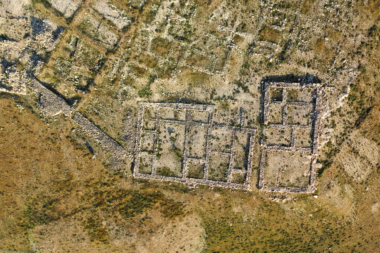 An aerial view shows the stone foundations and rectangular building structures uncovered at the ancient Hittite city of Sarissa in Sivas, Türkiye, Oct. 19, 2026. (AA Photo)