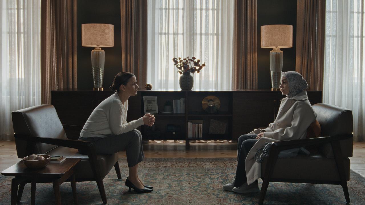 A therapist and a woman wearing a headscarf sit across from each other in a scene from the Turkish Netflix series Ethos (Bir Baskadir), released in 2020. (Photo via Netflix)