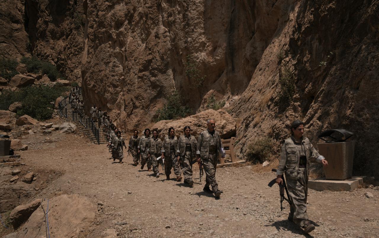The first group of PKK terrorists lays down and destroys their weapons in Sulaymaniyah, northern Iraq, on July 11, 2025. (AA Photo)