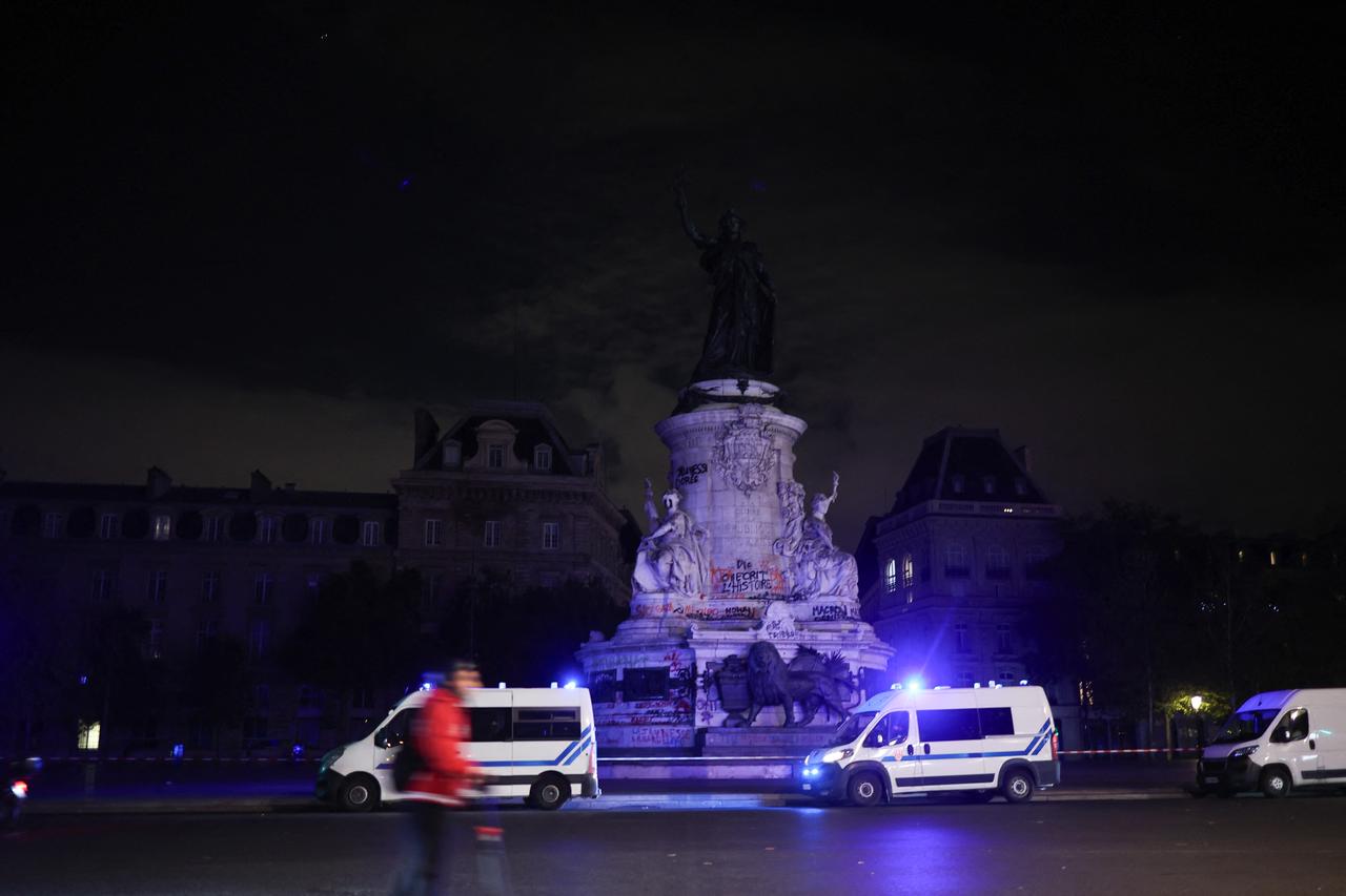 Police vans stand guard at Place de la Republique during a partial curfew in Paris in the early hours of October 21, 2026. (AFP Photo)