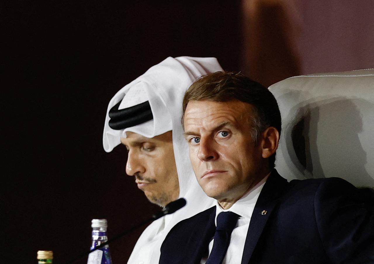 France's President Emmanuel Macron looks on as he sits next to Qatar's Prime Minister Sheikh Mohammed bin Abdulrahman al-Thani during the 9th Annual One Planet Sovereign Wealth Funds (OPSWF) Summit at the Rosewood Hotel in Lusail, October 21, 2026. (AFP Photo)