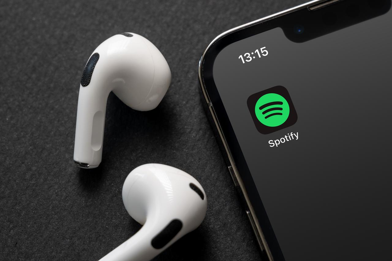 iPhone smartphone screen showing the Spotify Music App logo. (Adobe Stock photo)
