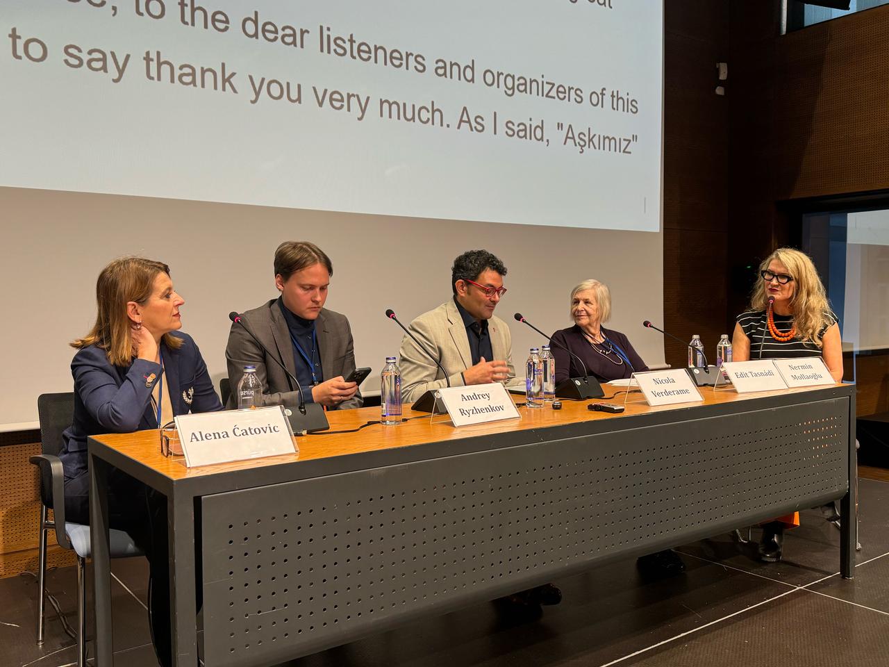 Translators Alena Catovic, Andrey Ryzhenkov, Nicola Verderame and Edit Tasnadi join moderator Nermin Mollaoglu during a panel on bringing Turkish novelist Ahmet Umit's works to international readers in Istanbul, Türkiye, Oct. 21, 2026. (AA Photo)
