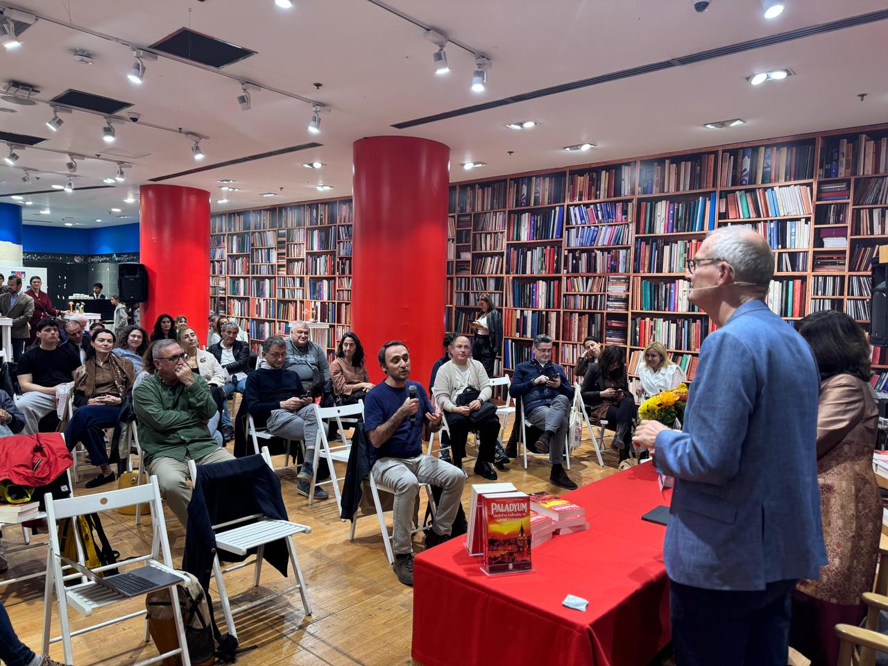Former British diplomat and author Leigh Turner speaks with attendees during a discussion of his new novel, Palladium: The Secret in the Heart of Istanbul, at D&R Kanyon in Istanbul, Türkiye, Oct. 20, 2026. (AA Photo)