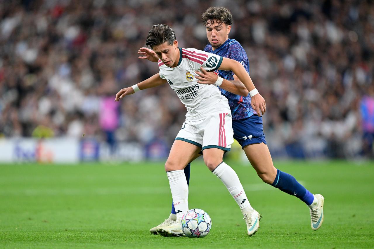 Arda Guler of Real Madrid in action against Neil El Aynaoui of RB Leipzig during the UEFA Champions League match between Real Madrid and RB Leipzig at the Santiago Bernabeu Stadium in Madrid, Spain on October 21, 2026. (AA Photo)