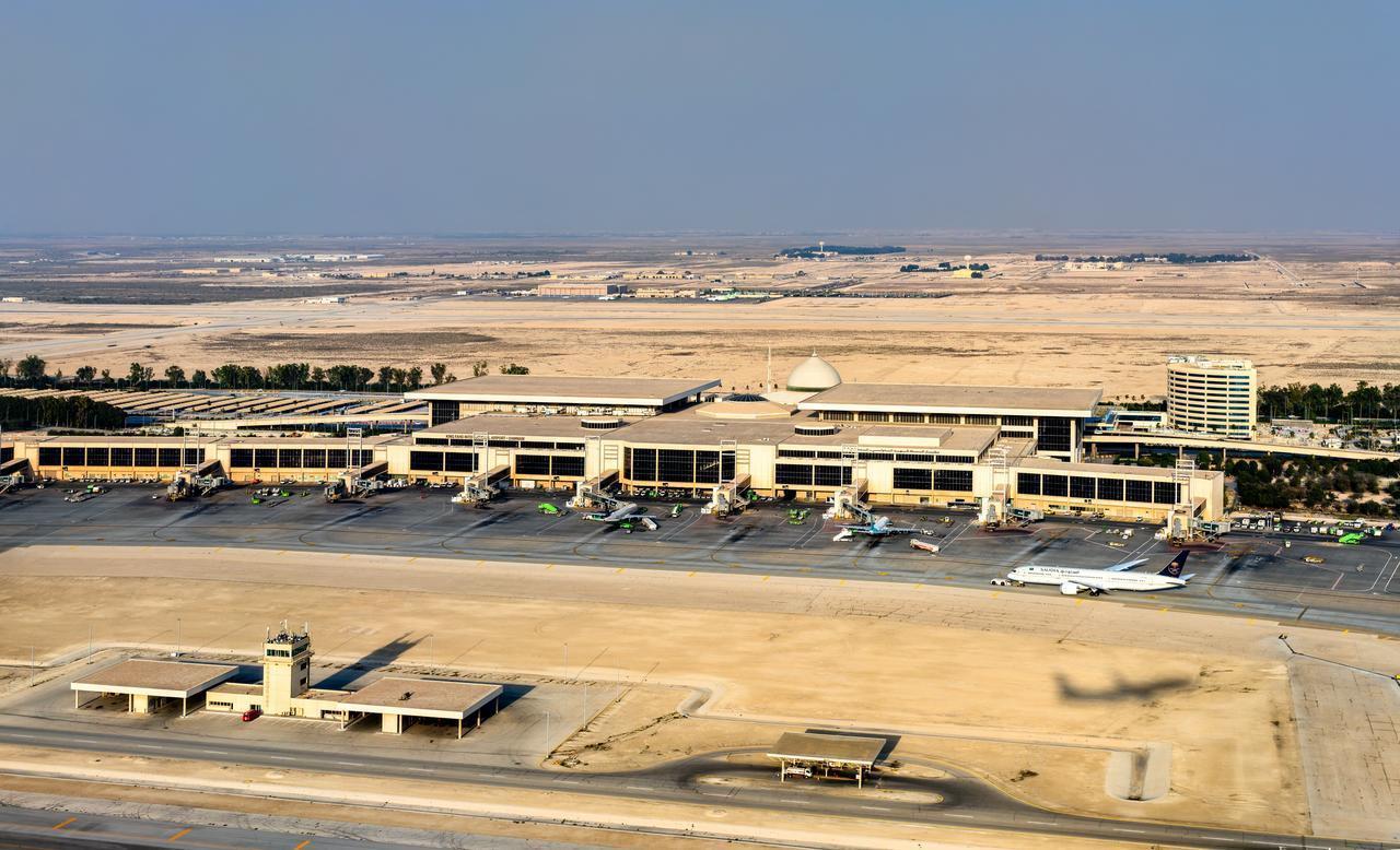 Aerial view of King Fahd International Airport in Dammam, Saudi Arabia, shows the terminal building and aircraft on the tarmac on Feb. 24, 2026. (Adobe Stock Photo)