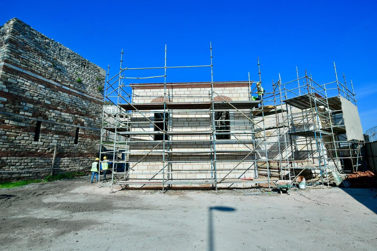 Workers reconstruct the exterior of the Bostancilar Tabhanesi Mosque beside Istanbul's historic sea walls, bringing back an Ottoman-era landmark demolished during coastal road development in the 1950s, Türkiye, October 22, 2026. (AA Photo)