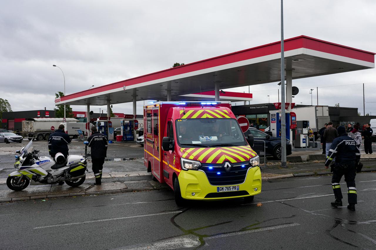Firefighters intervened at a petrol station site where a man opened fire from his car, killing one person and injuring four others, according to police sources, in Trappes, a suburb of Paris, on October 23, 2026. (AFP Photo)