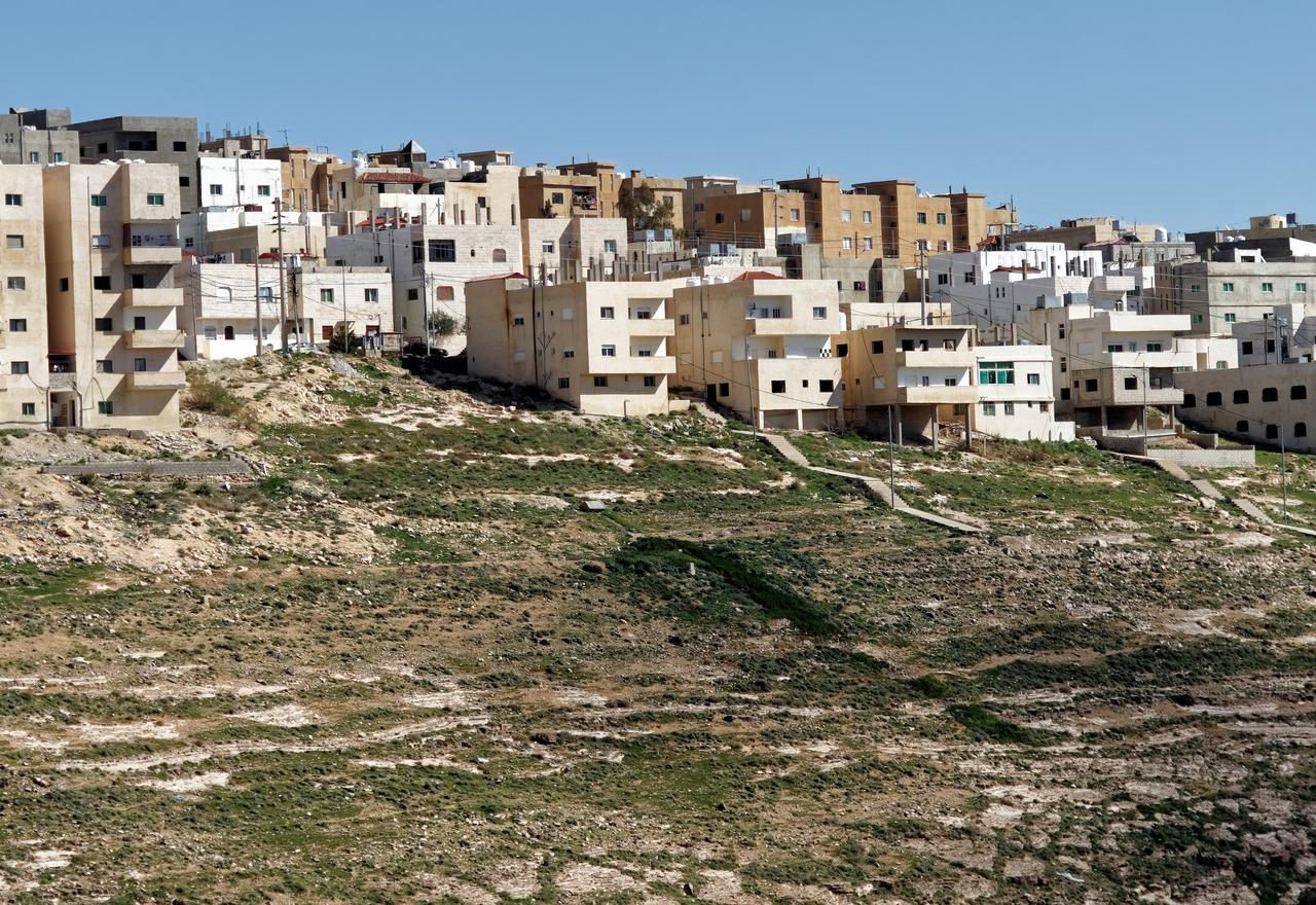 Low-rise residential buildings spread across the outskirts of Karak, southern Jordan. (Adobe Stock Photo)