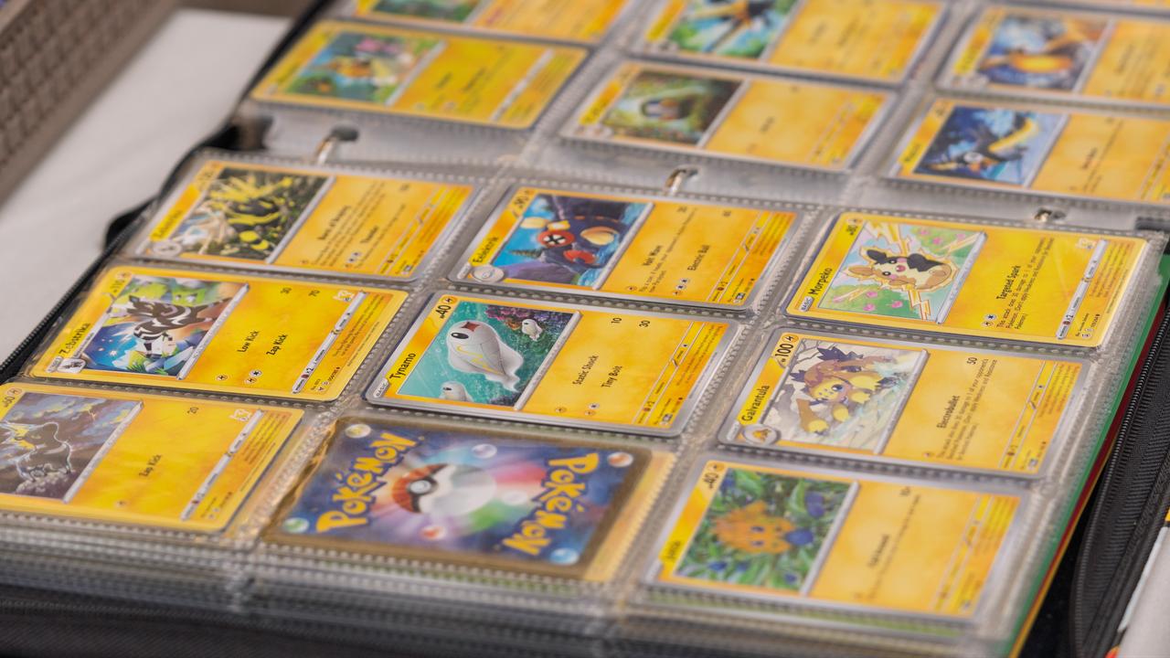 An assortment of Pokémon trading cards is displayed in protective sleeves inside a collector's binder. (Adobe Stock Photo)