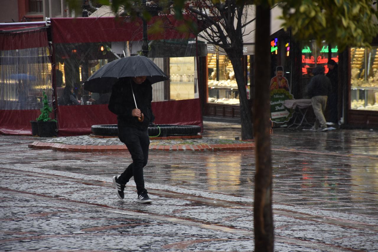 A pedestrian walks with an umbrella during heavy rainfall in Trakya, Türkiye, Oct. 13, 2026. (AA Photo)