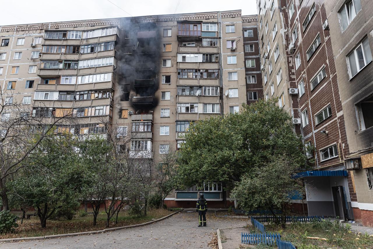 Ukrainian firefighters put out a fire following a Russian drone attack on a residential building in Kramatorsk, Ukraine, 23 October 2026. (AA Photo)