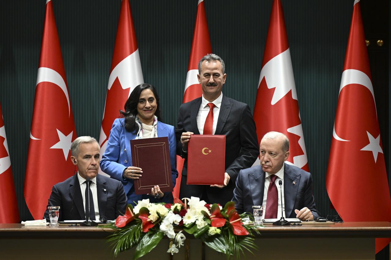 President Recep Tayyip Erdogan and Canadian Prime Minister Mark Carney are seen as President of Turkish Defense Industries Haluk Gorgun and Canadian Foreign Minister Anita Anand sign the "Memorandum of Understanding on Defense Sector Partnerships" in Ankara, Türkiye, on Oct. 22, 2026. (AA Photo)