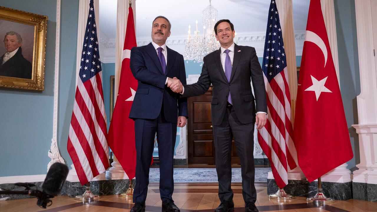 US Secretary of State Marco Rubio shakes hands with Turkish Foreign Minister Hakan Fidan in the Treaty Room of the State Department in Washington, DC, on March 25, 2025. (AFP Photo)