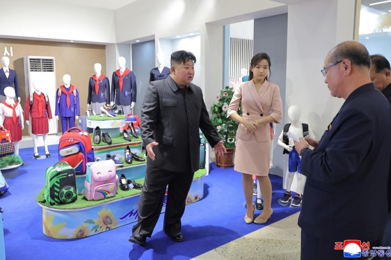 North Korean leader Kim Jong Un inspects children's footwear and school bags at a garment and footwear exhibition in North Korea, in an image released by state media on Oct. 19, 2026. (Photo via kcnawatch.de)